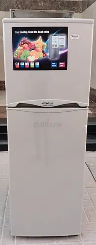 Whirlpool Refrigerator double door, Color silver, condition is cooling good