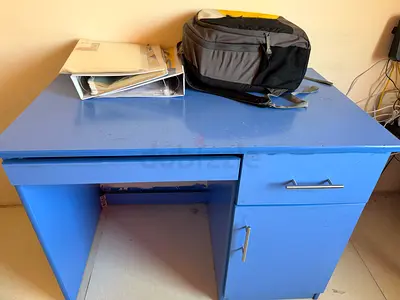 Blue single-person study desk with drawer and cabinet - used