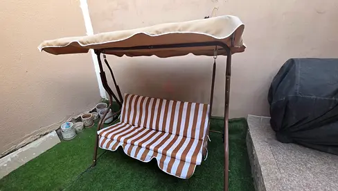2-seater outdoor garden swing with canopy - striped cushion