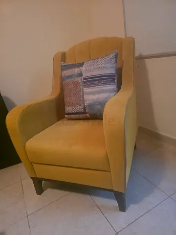 Single upholstered armchair in yellow-green fabric — good condition