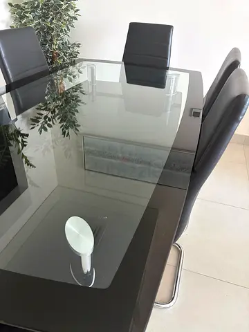 Glass Dining Table with 6 Black Leather Chairs