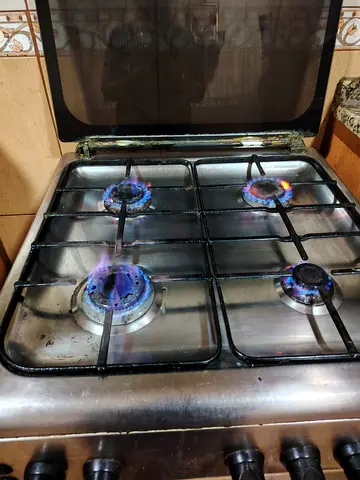 Used 4-Burner Stainless Steel Gas Stove in Working Condition