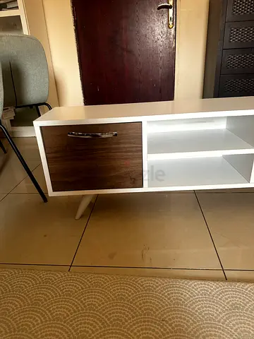 Small white storage cabinet with wood-finish door - good condition