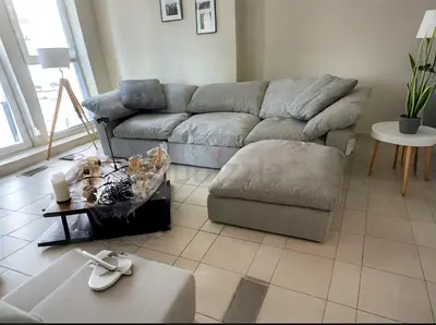 Excellent condition pan Emirates Pianca corner feather filled sofa with ottoman
