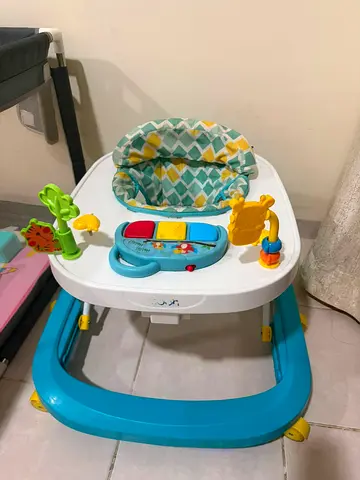 Baby activity walker with removable toy tray and padded seat - good condition