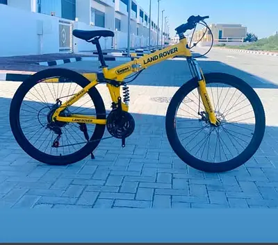 Yellow Land Rover Mountain Bike - 21 Speed, Front Suspension