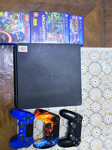 PS4 slim with 3 controllers and games