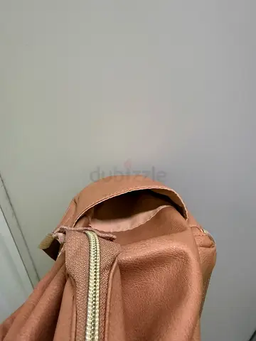 Light brown leather-look backpack — very light  used