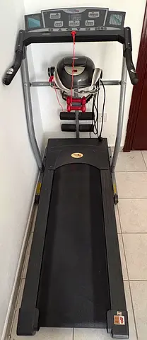 Used treadmill with built-in massager and 2 dumbbells - good working condition.