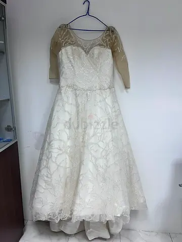 Ivory beaded tea-length wedding dress with sheer 3/4 sleeves