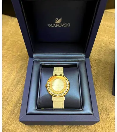 Swarovski women's crystal-embellished gold-tone watch with box