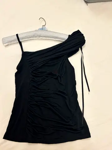 Black sleeveless women's top with side tie detail - size medium