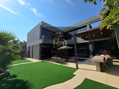 Luxury 4BR standalone villa with elegant majlis, private pool, premium furnishings, modern design, and high-end finishes.