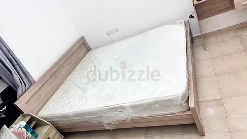 King bed frame with mattress and small bed also - light wood, good condition