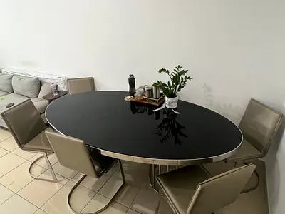 Urgent Sale of Modern black glass oval dining table with 6 leather cantilever chairs