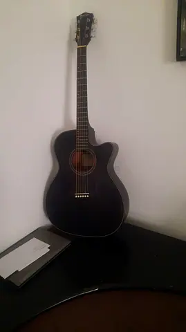 Black full-size acoustic-electric guitar with cutaway - good used condition