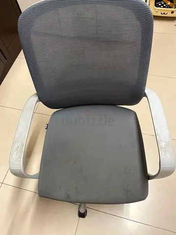 Used grey mesh office chair with armrests and wheels