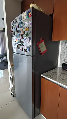Silver double-door fridge with top freezer - good working condition
