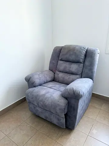 Grey single-seater recliner armchair in good condition