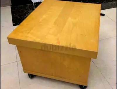 Small wooden coffee/side table on wheels - light maple finish