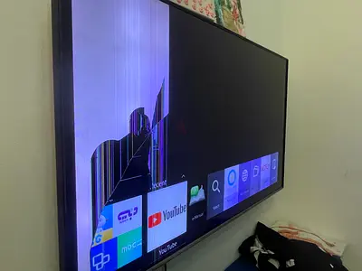 Broken 43-inch Smart TV (Screen cracked, powers on)