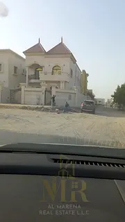 Corner villa in Al Muwaihat 1, price includes water, electricity, and air conditioning - negotiable 