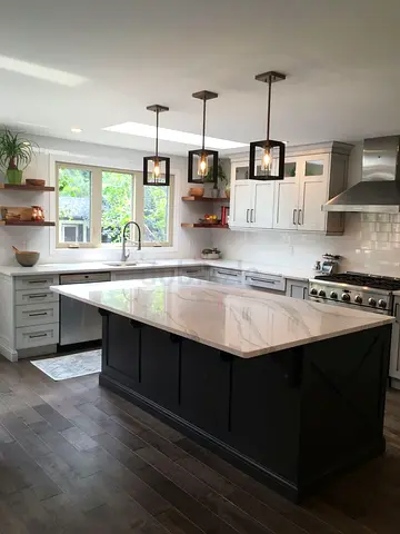 Modern kitchen island with marble top and pendant lights