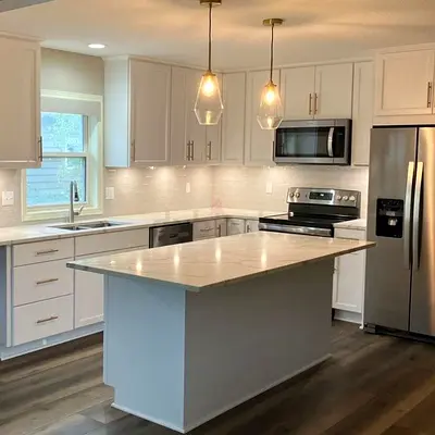 Modern white kitchen with storage and wooden top