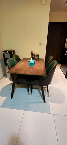 Compact wooden dining table with 4 upholstered chairs - good condition