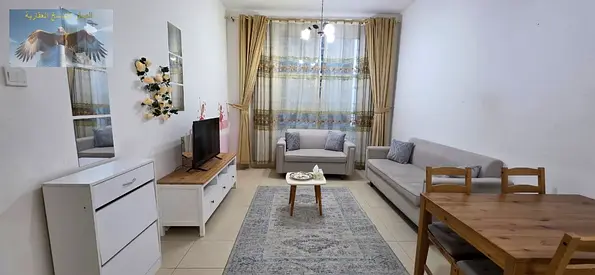 Furnished 1BR apartment in City Tower, Khalifa Street opposite Grand Mall, clean furniture, 2 bathrooms, balcony, bills, internet and private parking