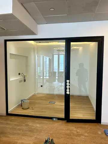 Glass partition office room with black frame —New
