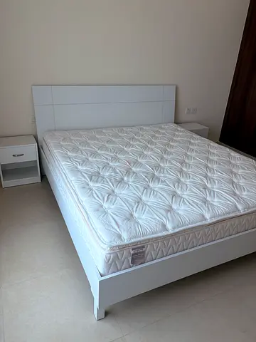 White double bed frame with mattress and bedside table - mint condition, never used.