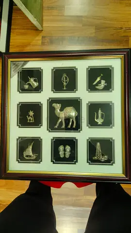 Framed Collection of 9 Brass Middle Eastern Miniatures with Camel Centerpiece-38x38cm