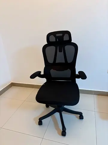 Ergonomic black office chair with adjustable armrests