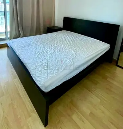 IKEA black queen bed with side table
