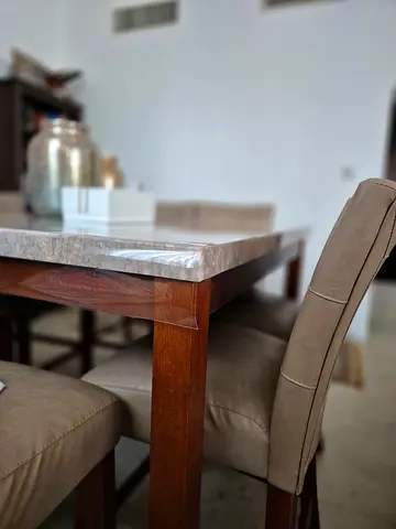 Wooden homecenter marble dining table with 8 chairs - excellent condition. Buy now thank me later