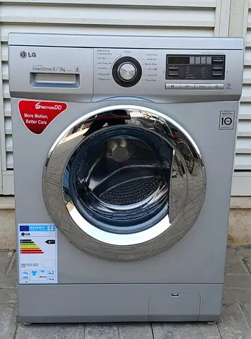 This frint load LG 6kg washing machine with 3kg full dryer, color silver, condition working good.