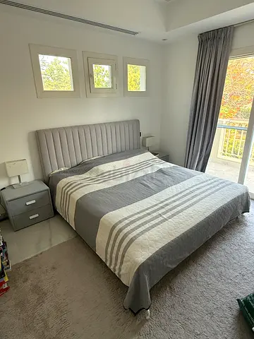 Queen upholstered bed with padded headboard and bedside drawer set