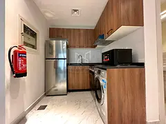 Unit Tawtheeq !! Fully Furnished | 1-Bedroom Apartment | Private Balcony | American Style Kitchen | 