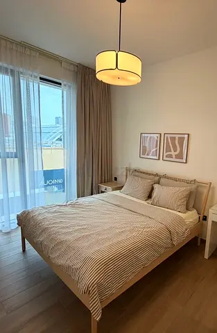 Bed with mattress and side table
