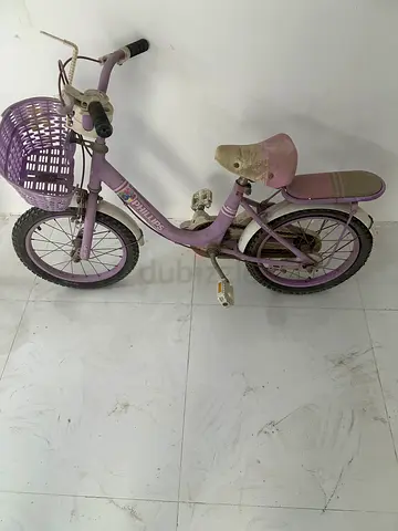 Used small kids purple bicycle with basket — needs cleaning/repair