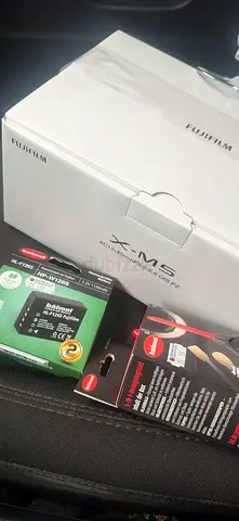 Camera selling urgent fujifilm Xm5 sealed  - like new, unused in original box with extra charge