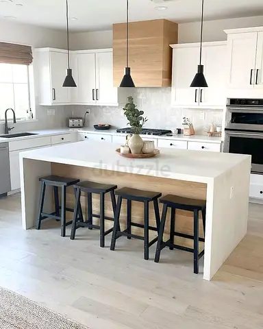 Modern White Kitchen Island with Built-in Seating and Wood Accent