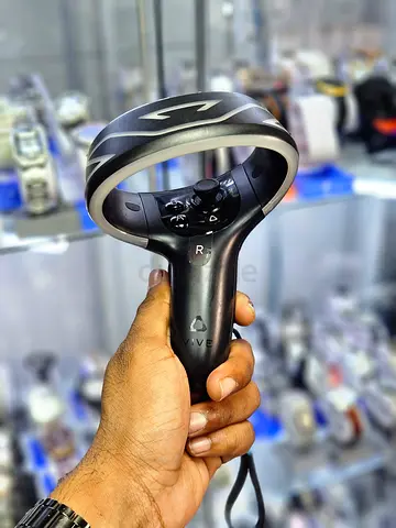 HTC Vive Cosmos VR controllers featuring a tracking ring design.