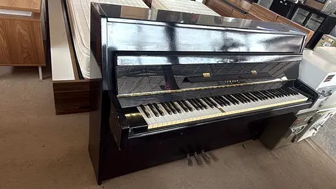 Upright Piano in good working condition - glossy black