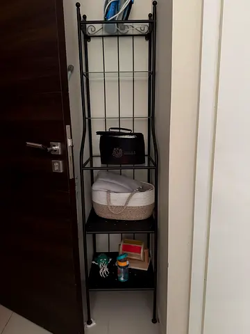 Tall black metal shelving unit with 3 shelves — good condition