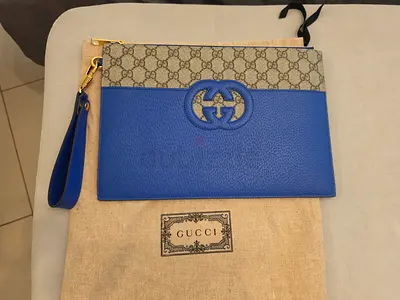 Gucci GG Supreme blue leather clutch - authentic / new