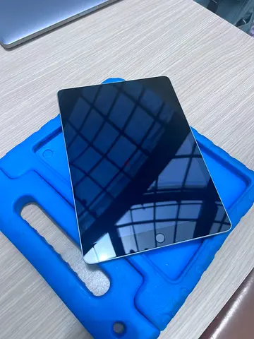 iPad (Apple) in excellent condition with blue protective case