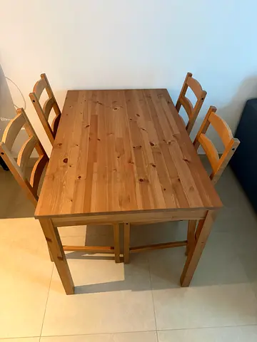 Solid wood dining table with 4 matching chairs - good condition