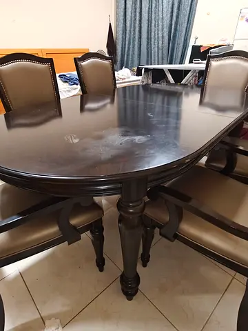 Solid dark wood 6-seater expandable to 8-seater dining table with chairs - good condition